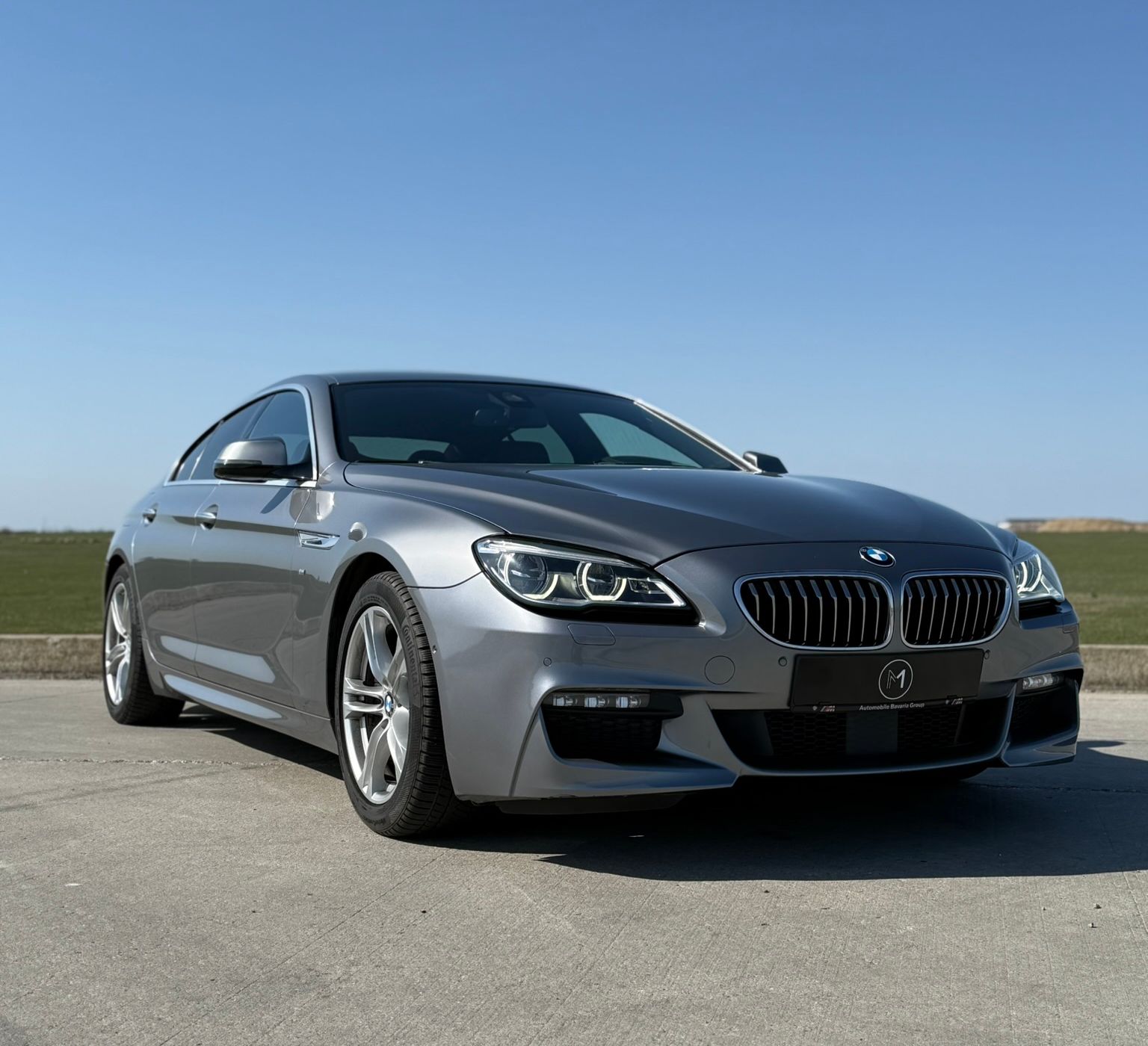 BMW Seria 6 Gran Coupé gri, vedere față trei sferturi, pachet M Sport