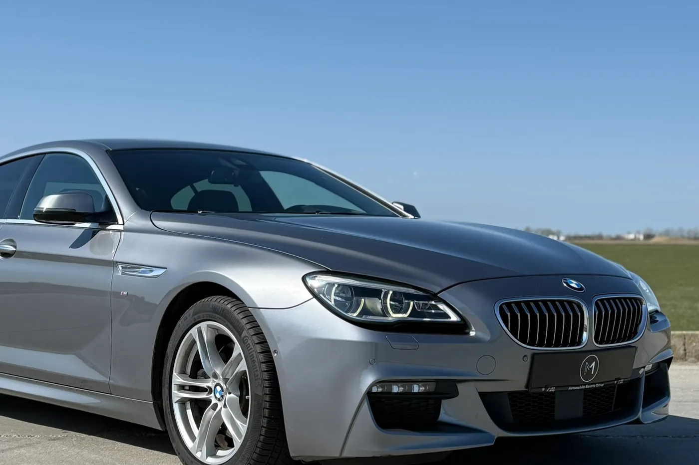 BMW Seria 6 Gran Coupé gri, față trei sferturi