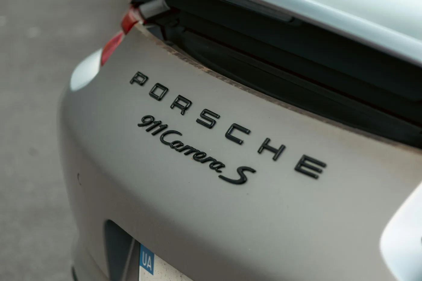 Detaliu posterior Porsche 911 Carrera S, finisaj satin, inscripție 911 Carrera S